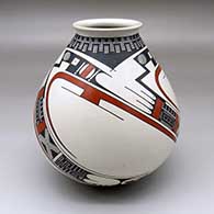 A polychrome jar with a flared lip and a three-panel geometric design
 by Juan Quezada Sr of Mata Ortiz and Casas Grandes