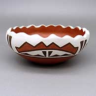 Polychrome bowl with a pie crust rim and a geometric design
 by Donna Pino of Santa Ana