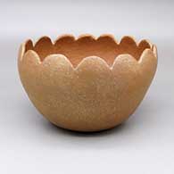 Micaceous gold bowl with a scalloped rim
 by Cordelia Gomez of Pojoaque
