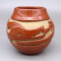 Red jar with a carved avanyu design
 by Teresita Naranjo of Santa Clara