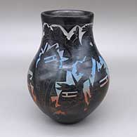 Black and rainbow painted jar with a slightly flared opening and a sgraffito dancer, koyemsi, bear-with-heart-line, ear-of-corn, kiva step, and geometric design
 by Ergil Vallo of Acoma