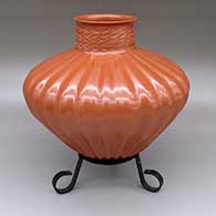 Red melon jar with twenty-seven ribs, a slightly flared opening, and a carved geometric design around the neck
 by Hector Ortega of Mata Ortiz and Casas Grandes