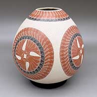 Polychrome jar with a sgraffito and painted geometric design and a lightly carved texture
 by Hector Quintana of Mata Ortiz and Casas Grandes