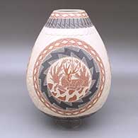 Polychrome jar with a sgraffito and lightly carved three-panel deer, tree, stone, and geometric design
 by Eleazar Quintana of Mata Ortiz and Casas Grandes