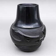 Black jar with a carved avanyu design
 by Helen Shupla of Santa Clara