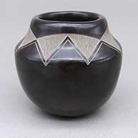 Small black jar with a sgraffito geometric design
 by Andrew and Judy Harvier of Santa Clara