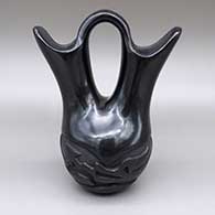 Black wedding vase with a carved avanyu design
 by Mary Cain of Santa Clara