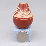 Miniature red jar with a sgraffito raincloud and geometric design
 by Haungooah aka Art Cody of Santa Clara