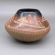 Sienna jar with a black rim and a sgraffito feather ring and geometric design
 by Susan Folwell of Santa Clara