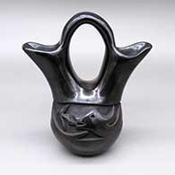 Black wedding vase with a carved avanyu and kiva step geometric design
 by Teresa Gutierrez of Santa Clara