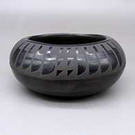 Black-on-black bowl with a feather ring and geometric design
 by Clara Martinez of San Ildefonso