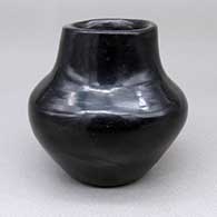 Small polished black jar
 by Russell Sanchez of San Ildefonso