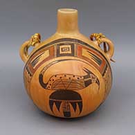 Polychrome canteen with bird and geometric design, fire clouds, and leather strap
 by Jean Sahmie of Hopi