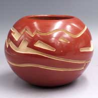 Polished red bowl carved with an avanyu design around the shoulder
 by Joey Chavarria of Santa Clara
