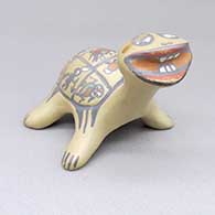 Polychrome turtle figure with a painted design on the shell featuring bird, lizard, insect, fish, crab, ant, and dancer elements
 by Margaret Gutierrez of Santa Clara