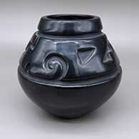 Black jar with a carved geometric design
 by Margaret Tafoya of Santa Clara