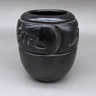 Black jar with a four-panel carved geometric design
 by Mela Youngblood of Santa Clara