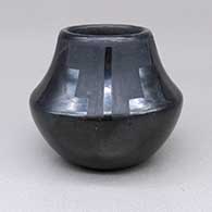 Small black-on-black jar with a four-panel painted kiva step and geometric design
 by Rose Gonzales of San Ildefonso