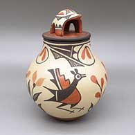 Polychrome lidded jar with a roadrunner, flower, and geometric design and a matching lid with a turtle applique
 by Elizabeth Medina of Zia