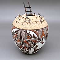 Polychrome jar with a painted three panel deer-with-heart-line, butterfly, kiva step, fine line, and geometric design, an intricate miniature applique, painted, and mixed media pueblo scene, and a ladder detail leading into the opening
 by Noreen Simplicio of Zuni