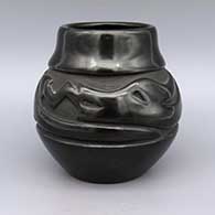 Black jar with carved avanyu design
 by Mary Singer of Santa Clara