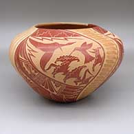 Polychrome jar with a split design featuring a sgraffito hummingbird, flower, feather, and geometric design on one half and a carved melon design with twenty-four ribs on the other
 by Vangie Tafoya of Jemez