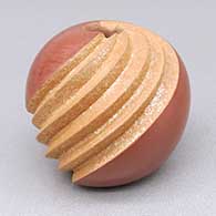 Small red and micaceous gold jar with a spiral melon design
 by Dominique Toya of Jemez