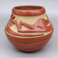 Red jar with a carved avanyu design
 by Teresita Naranjo of Santa Clara
