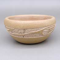 Micaceous buff bowl with a polished inside and a sgraffito avanyu design
 by Jennifer Tse Pe of San Ildefonso