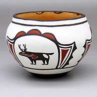 A polychrome bowl decorated with a three-panel deer-in-his-house and geometric design
 by Nellie Bica of Zuni