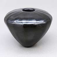 Small polished black jar with a faceted design
 by Denny Gutierrez of Santa Clara