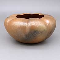 Micaceous gold melon bowl with eight ribs and fire clouds
 by Angie Yazzie of Taos