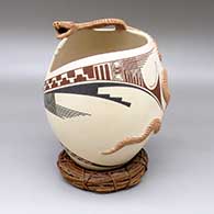 Polychrome jar with a geometric cut opening, an applique rattlesnake detail, and a painted geometric design
 by Rito Talavera of Mata Ortiz and Casas Grandes