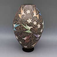 Polychrome jar with sgraffito and painted hummingbird, flower, and branch design
 by Elicena Cota of Mata Ortiz and Casas Grandes