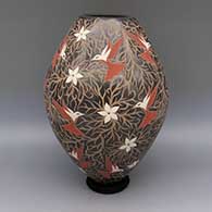 Polychrome jar with sgraffito and painted hummingbird, flower, and branch design
 by Elicena Cota of Mata Ortiz and Casas Grandes