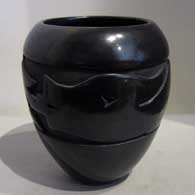 Black jar carved with avanyu design 
 by Mida Tafoya of Santa Clara