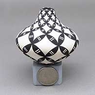 Miniature black-on-white jar with a geometric design
 by Dorothy Torivio of Acoma