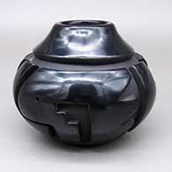 Black jar with a carved kiva step and geometric design
 by Robert Nichols of Santa Clara