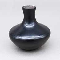 Small polished black jar with a flared neck and opening
 by Greg Garcia of Santa Clara