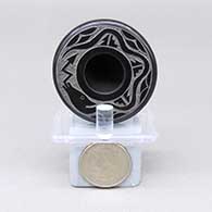 Miniature black jar with a sgraffito avanyu, kiva step, and raincloud design
 by Monica Naranjo of Santa Clara