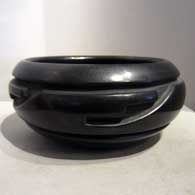 Black bowl carved with geometric design
 by Unknown of Santa Clara