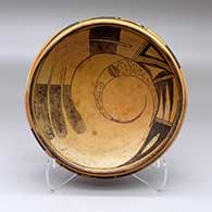 Click for a larger view A black on yellow bowl decorated inside with a bird hanging from sky band and geometric design and outside with a bird element and geometric design
by Nampeyo of Hano of Hopi