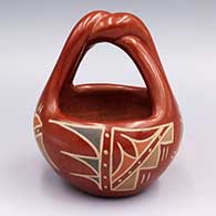 Polychrome basket style jar with twisted handle
 by Petra Montoya of Santa Clara
