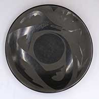 Black-on-black dish with an avanyu and geometric design
 by Unknown of Santa Clara