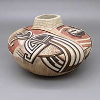 Polychrome jar with an organic square opening, an adobe brick texture on neck and a lightly carved and painted dancer and geometric design over a textured background
 by Gary Polacca Nampeyo of Hopi