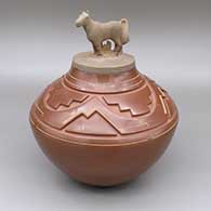 Red lidded jar with sgraffito and carved geometric design and matching lid with a sculpted horse applique
 by Jeff Roller of Santa Clara
