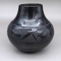 Black-on-black jar with a painted geometric design
 by Maria Martinez of San Ildefonso