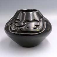 Black jar carved with an avanyu and geometric design above the shoulder
 by Anita Suazo of Santa Clara