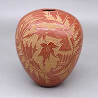Red jar with a sgraffito hummingbird, flower, feather ring, and geometric design
 by Vangie Tafoya of Jemez