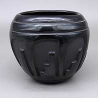 Black jar with an eight-panel kiva step geometric design
 by Pablita Chavarria of Santa Clara